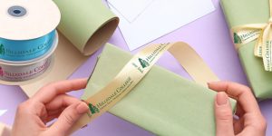 Ribbon rolls with a business logo used for wrapping gifts for an award.