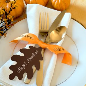 Place setting for an Autumn event is embellished with a custom ribbon to use ribbons as one of the key benefits: decorating.