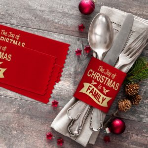 Christmas place setting uses a custom imprinted badge ribbon with a holiday message.