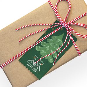 A custom top ribbon used as a gift tag and attached a package.