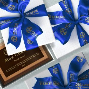 Award plaques are ready for distribution in a gift box tied with custom ribbon.