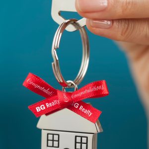 Keys embellished for a new home owner with a custom imprinted ribbon.