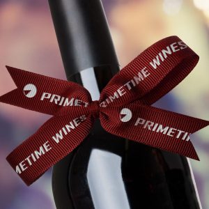 A ribbon tied around a wine bottle.